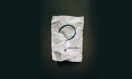 Question mark on a piece of paper