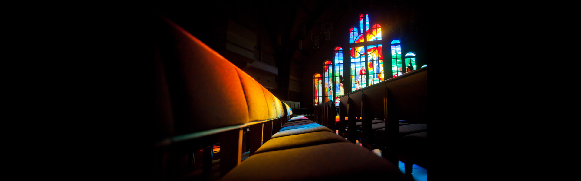 Light shining through the stained glass windows in the Chapel sanctuary