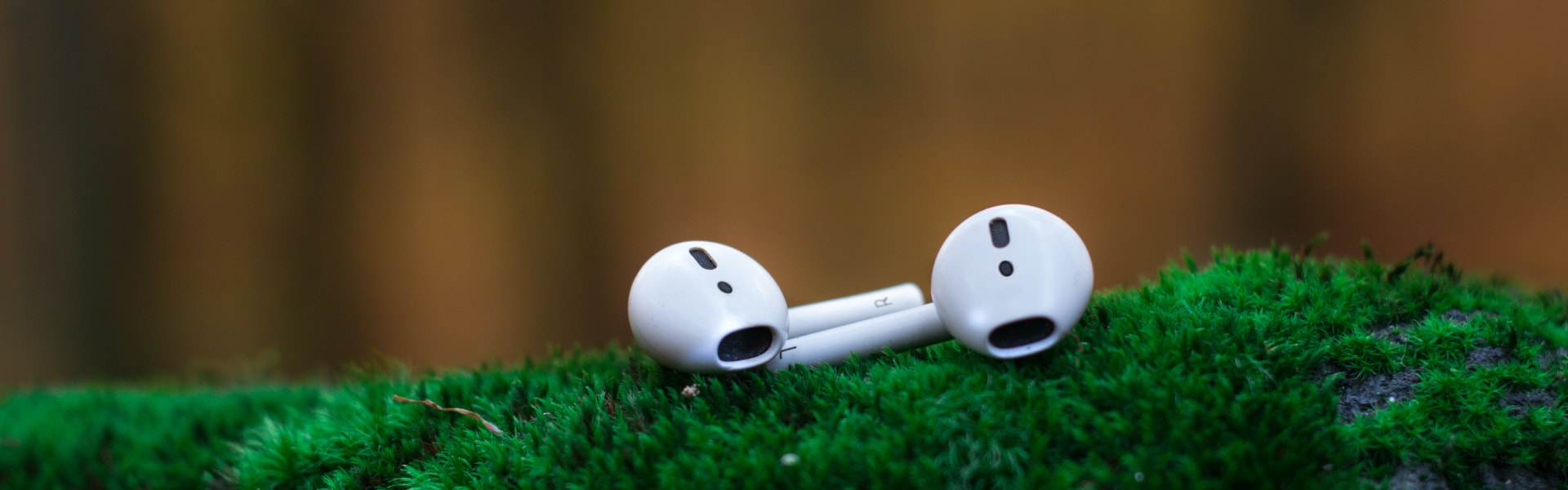 Close-up photos of white earbuds